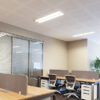 Commercial office space with office furniture and LED Troffer lights