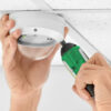 Ledfire Dome in ceiling being installed with screwdriver