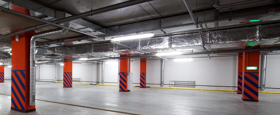 Batten lights illuminating an underground carpark